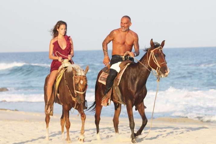Christian Audigier and girlfriend Nathalie Sorensen enjoy a romantic getaway weekend in Cabo San Lucas, where the couple came to celebrate the Mexican Independence Day. After a nice long walk on the beach, the couple were spotted sharing a kiss and riding along the beach on horseback. Cabo San Lucas, Mexico - 15.09.11 Mandatory Credit: BAC/WENN.com/christian_audigier_160911.audigier_sorensen_09/1109161455