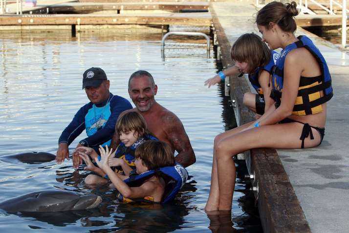 Fashion designer Christian Audigier and Nathalie Sorensen celebrate Thanksgiving with his children, Dylan, Rocco and Vito, on a trip to see dolphins in the new marina of Puerto Los Cabos. Cabo San Lucas, Mexico - 24.11.11 Credit: (Mandatory): BAC/WENN.com/audigier_dolphin_251111.Christian_Audigier_14_/1111252310
